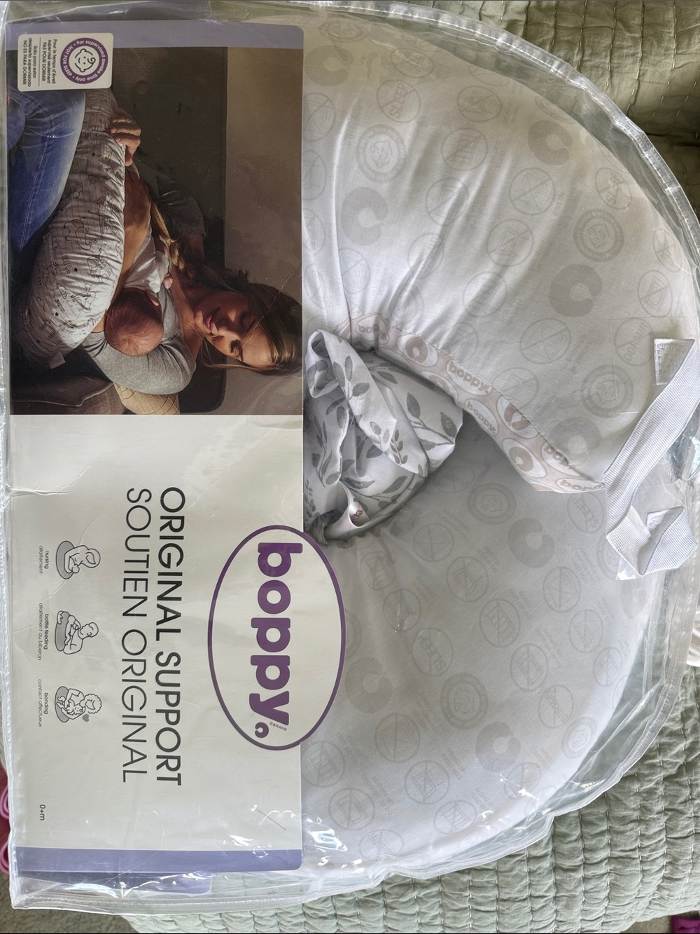 Boppy Nursing Pillow with White & Gray Soft Patterned Cover.